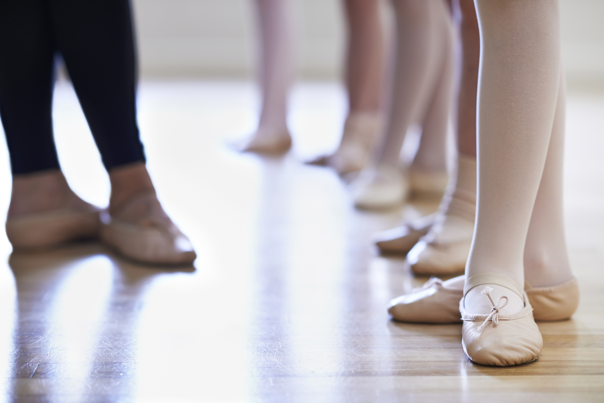 Close Up Of Teacher And Children's Feet In Ballet Dancing Class